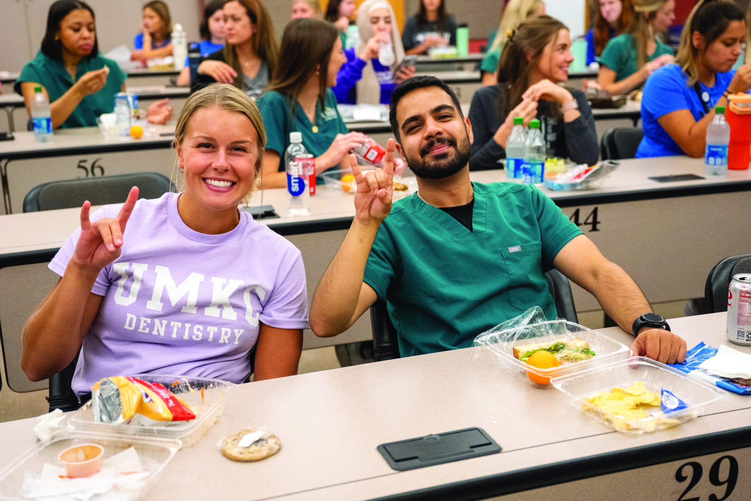 two dental students giving the roo up sign