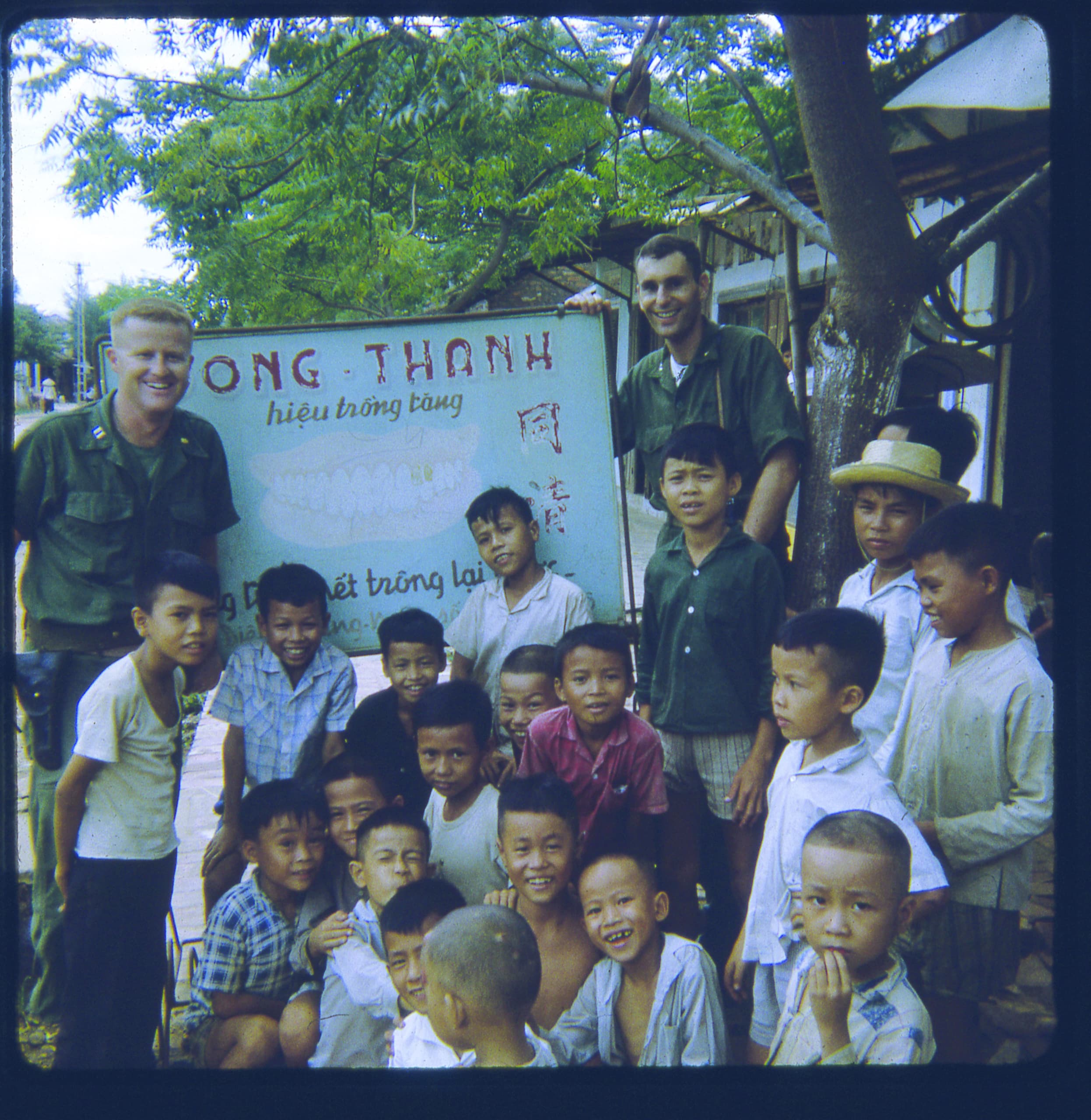 Lt. Cmdr. Peter Steinhauer with children in Da Nang, Vietnam