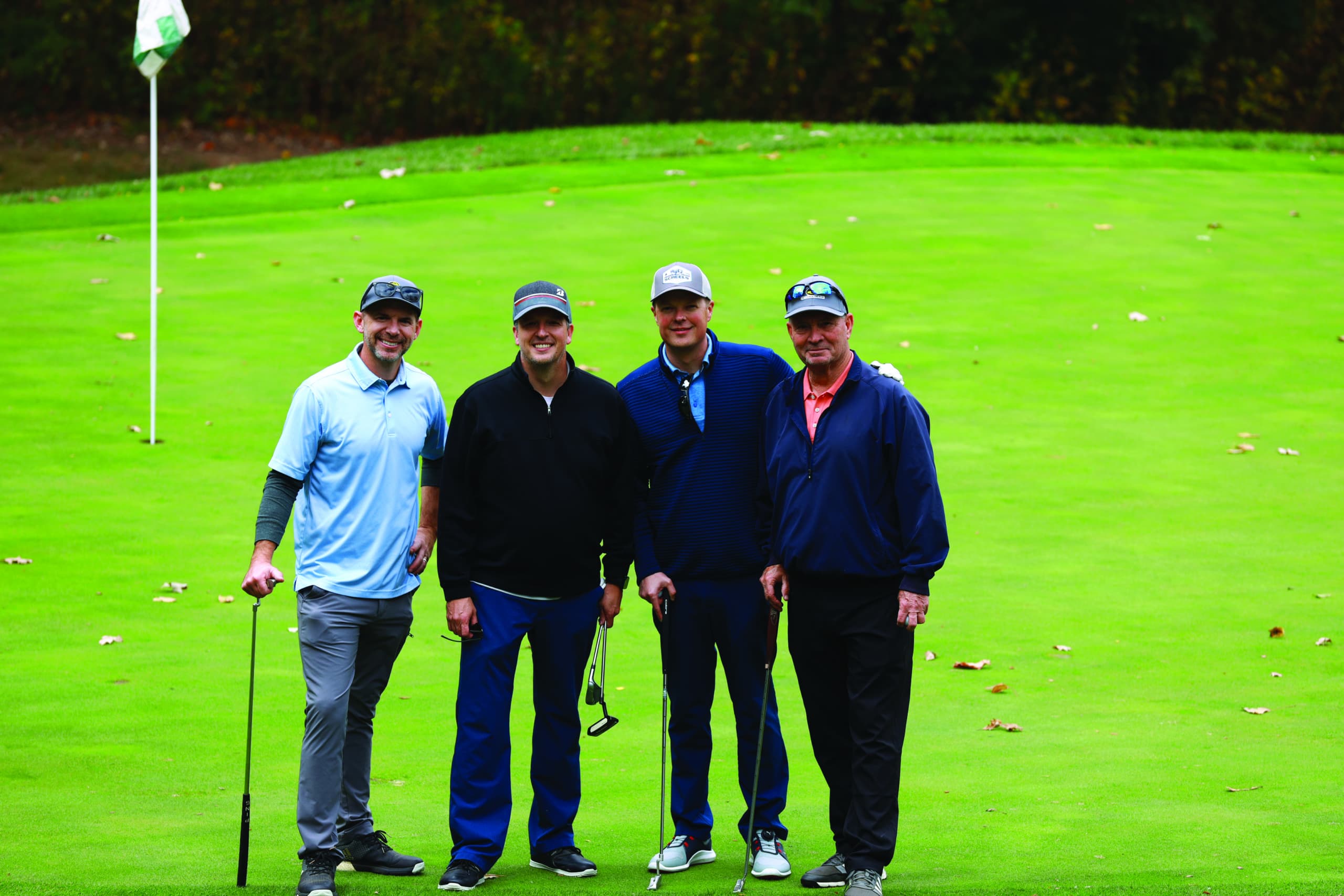 four attendees of the UMKC Dental Alumni Scholarship Golf Tournament at WinterStone Golf Course