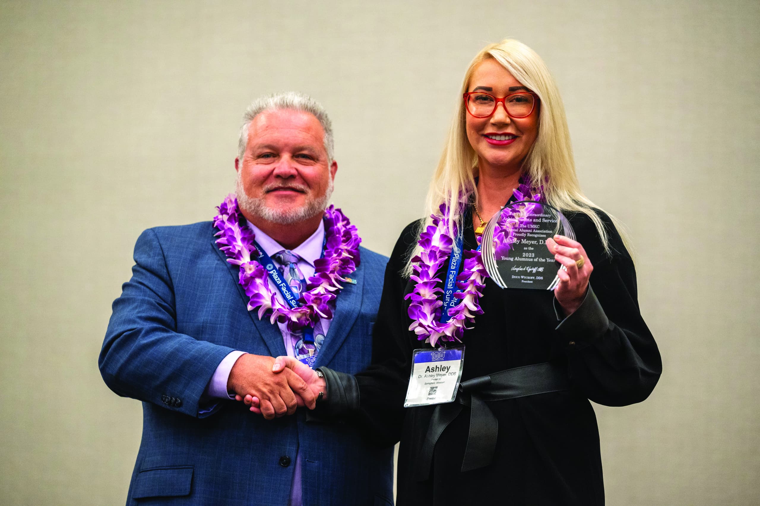 female receiving award