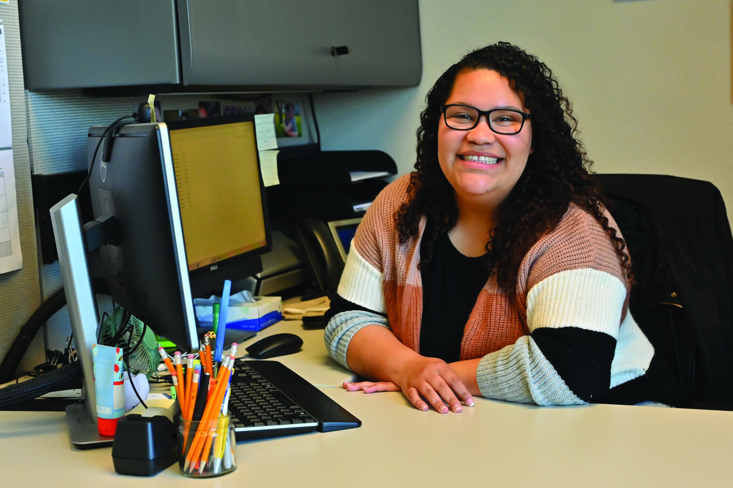 Deja Lamb smiling from desk