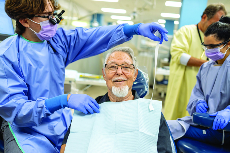patient in chair smiling at camera