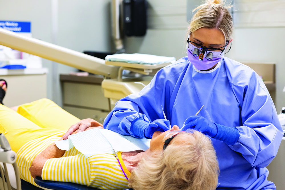 dentist and patient in chair during procedure