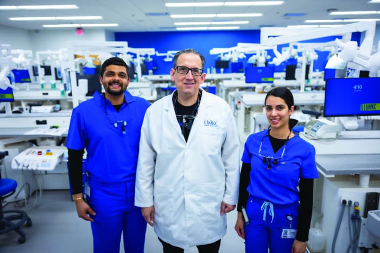 three people in group photo